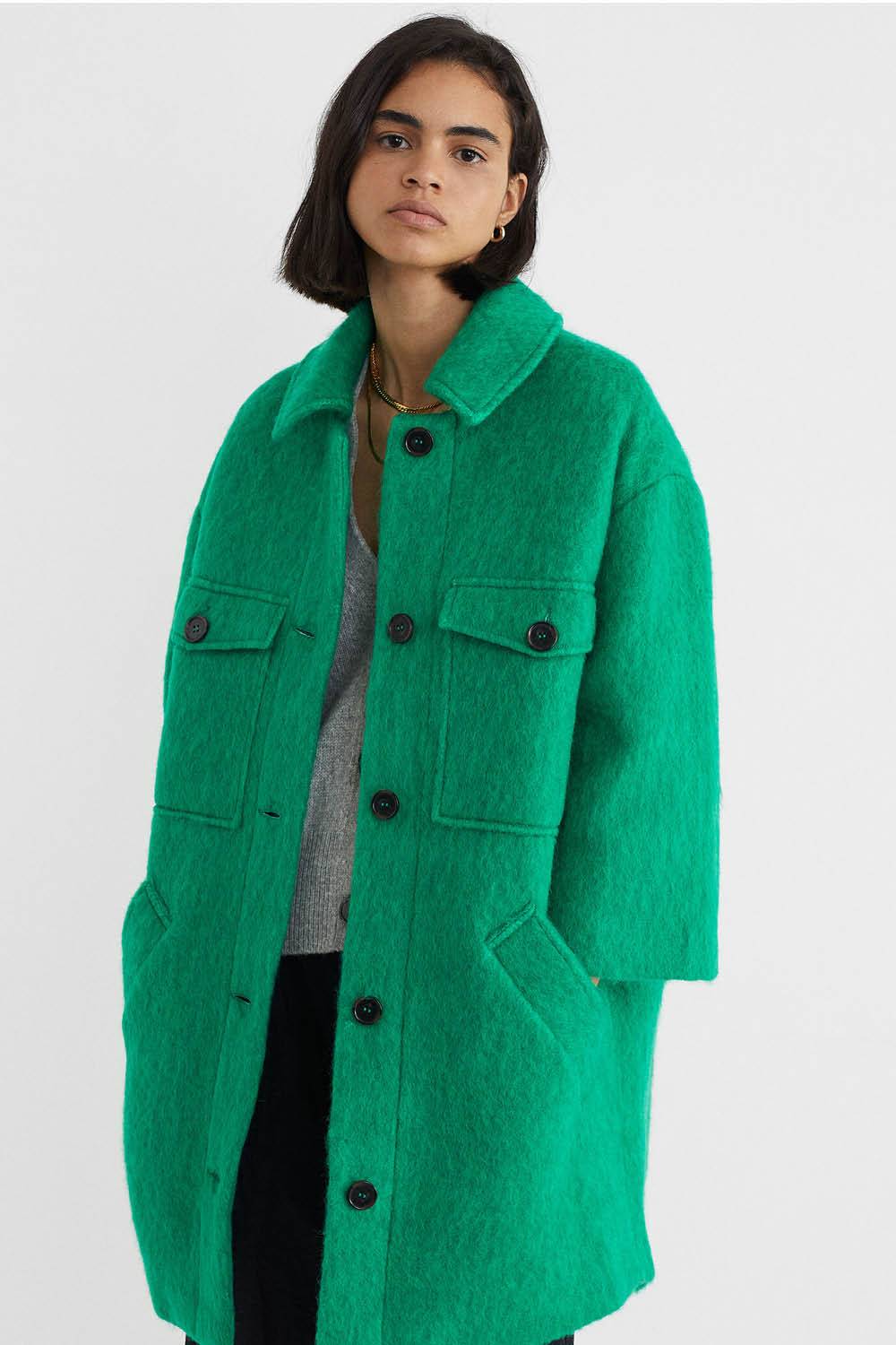 Abrigo verde manga tres cuartos parfois